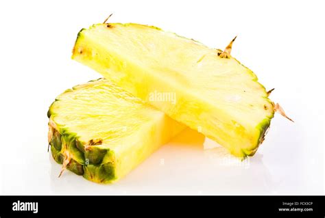 Pineapple slices on White background Stock Photo - Alamy