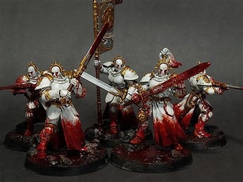 Some White And Red Painted Warhammers With Swords