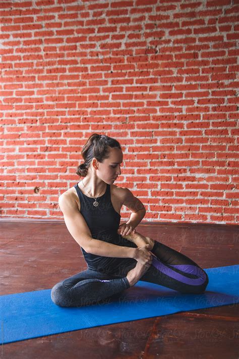 Athletic Young Woman Performing Yoga Pose By Stocksy Contributor