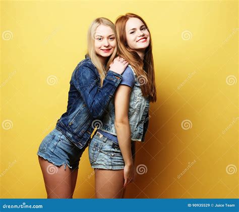 Lifestyle And People Concept Two Girl Friends Standing Together Stock