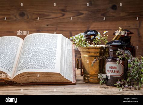 The Ancient Natural Medicine Herbs Medicines And Old Book Stock Photo