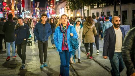 Woman Walking Alone Among Crowd Of People In Istanbul City Life