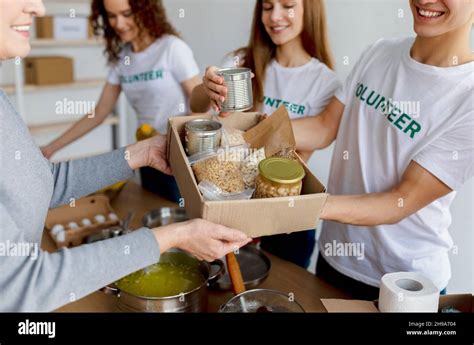 Volunteer Work Young Activists Giving Food In Carton Boxes As Donation