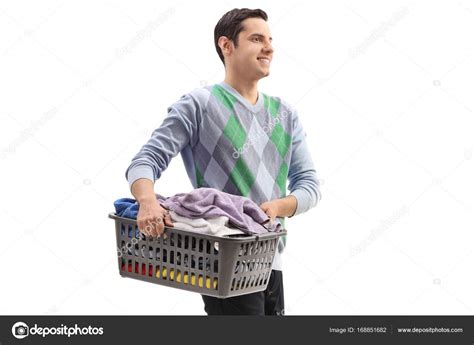 Man Holding A Laundry Basket Full Of Clothes Stock Photo By