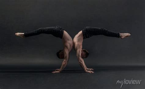 Two Twin Brothers In Black Jeans With A Naked Torso Perform Acrobatic Adesivos Para A Parede