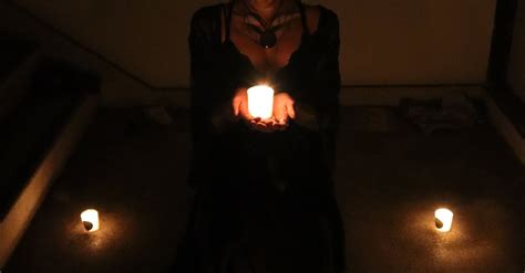 Woman in Scary Costume with Candles in Dark · Free Stock Photo