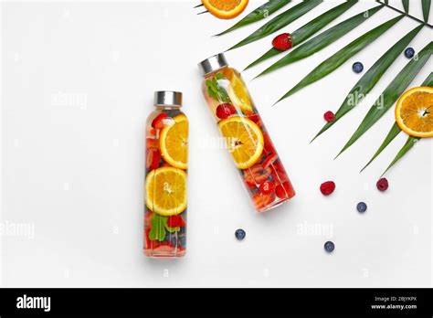 Bottles Of Tasty Infused Water On White Background Stock Photo Alamy