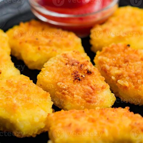 Fried Crispy Chicken Nuggets With Ketchup On Black Plate Unhealthy