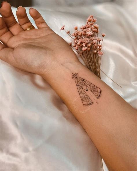 Our Lady Of Aparecida Tattoo Located On The Wrist Fine