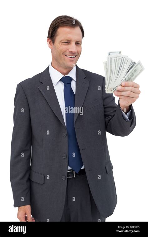 Smiling Businessman Holding Bills Stock Photo Alamy