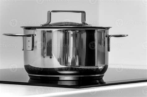 Stainless steel cooking pot on the induction stove 34867110 Stock Photo ...