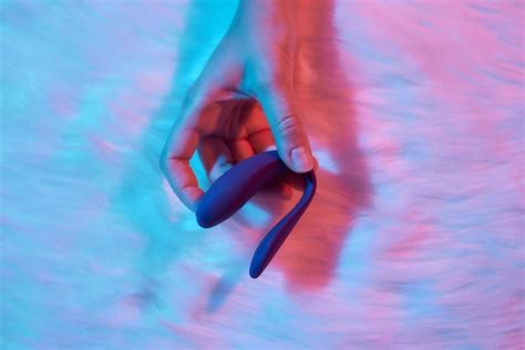 Premium Photo Desire Concept Woman Lying In Bed Holding A Dildo Vibrator In Her Hand To Help