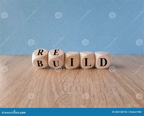 Rebuild Symbol Concept Word Rebuild On Wooden Cubes On A Beautiful