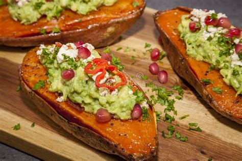 Healthy Food Baked Sweet Potatoes Served With Guacamole Feta Cheese