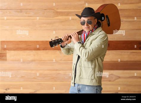 Mature Cowboy With Guitar On Wooden Background Stock Photo Alamy