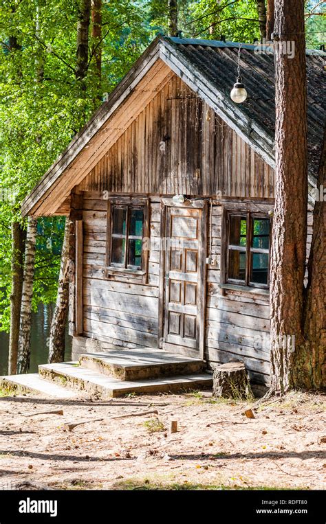 Shabby Old Traditional Wooden Forest House With Wooden Door Entrance