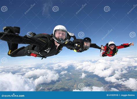 Three Skydivers Form A Line Stock Photo Image Of Holding Skydiving