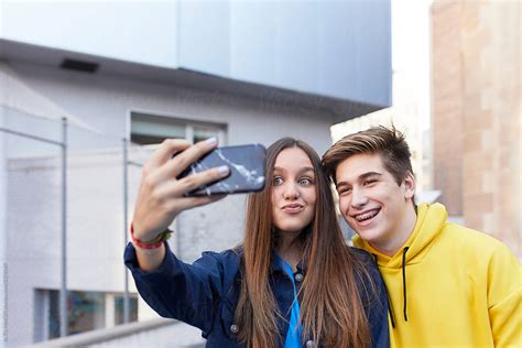 Teenage Couple Taking A Selfie By Stocksy Contributor Alto Images