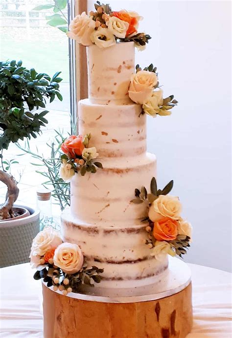 Semi Naked Cake With Gold Flecks And Peach Flower Clusters Bay Tree Cakes