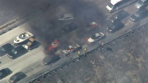 Dozens Of Cars Set Ablaze As Wildfire Jumps California Freeway