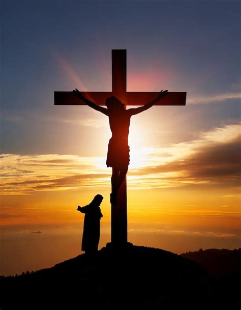 Silhouette of Jesus Christ and cross at sunset | Premium AI-generated image