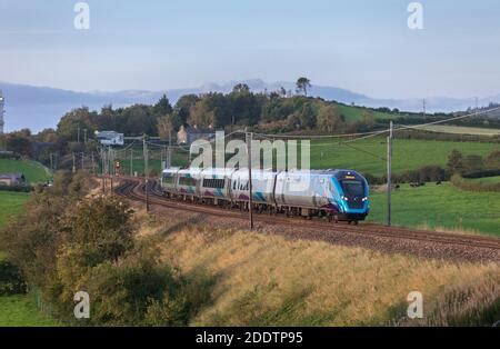 First Transpennine Express CAF class 397 Nova 2 train on the west coast mainline at sunset Stock ...