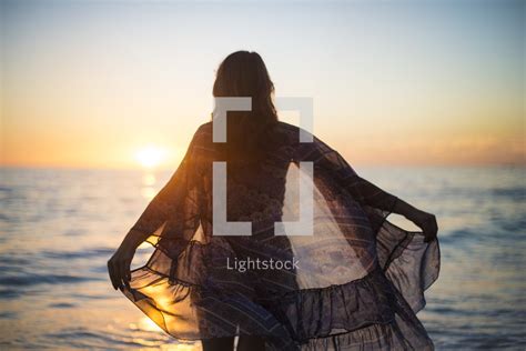 A Woman In A Sheer Shirt Standing In Front Of — Photo — Lightstock