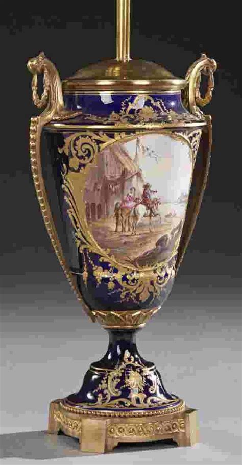 An Ornately Decorated Vase With Gold Trimming