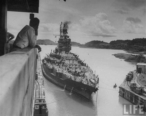 An Older Us Battleship Passing Through The Panama Canal Following The Surrender Of The Japanese