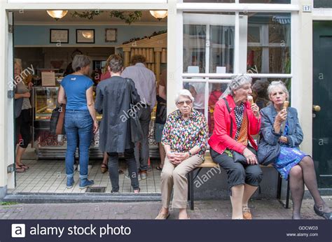 Elderly Woman Eating Ice Creams Amsterdam Holland Stock Photo Alamy