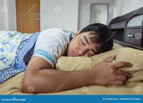 The Asian Man Sleeping At Bed In The Morning Time Stock Photo Image