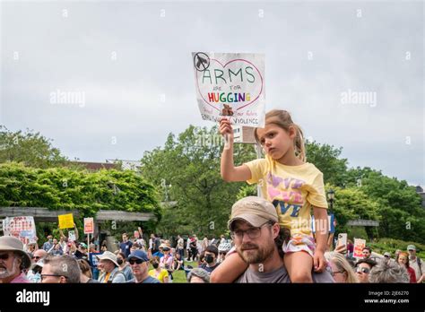 Young Girl On Her Fathers Shoulders Hold Protest Sign March For Our