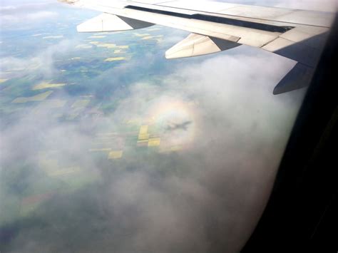 Airplane seen through the clouds from an airplane - Travel Moments In ...