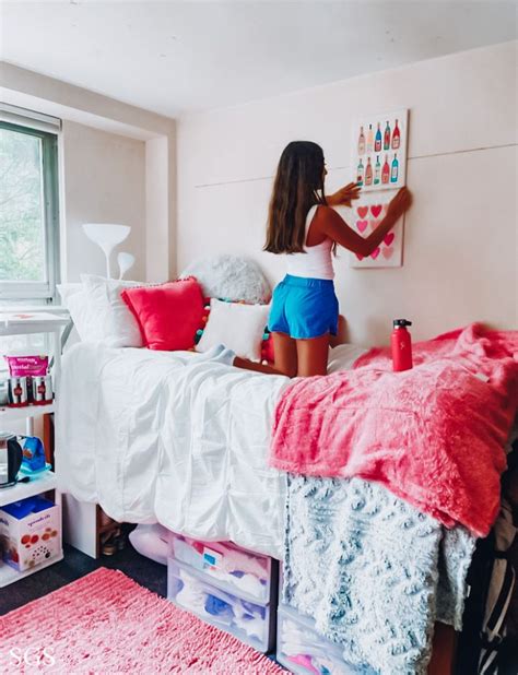 A Girl Is Painting On The Wall In Her Bedroom