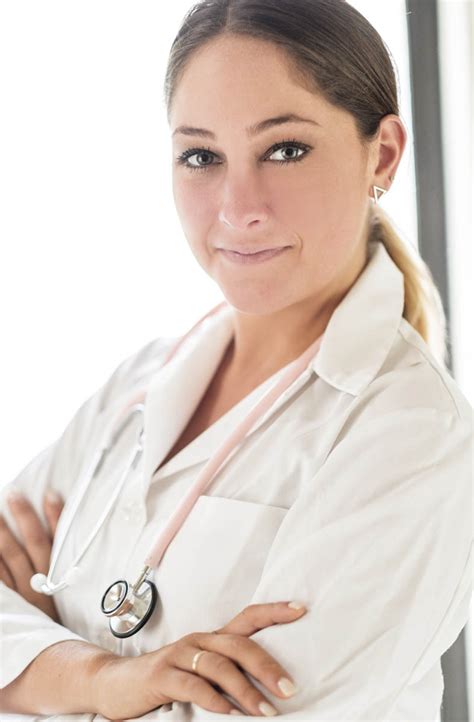 Portrait of female doctor with arms crossed in hospital - StockFreedom ...