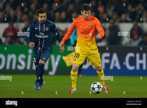 Psg S Ezequiel Lavezzi Battling Barcelona S Lionel Messi During The