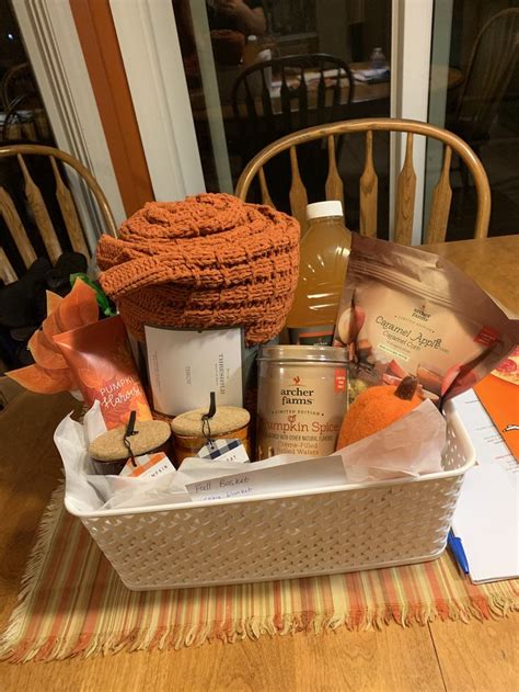 A Basket Filled With Food Sitting On Top Of A Wooden Table