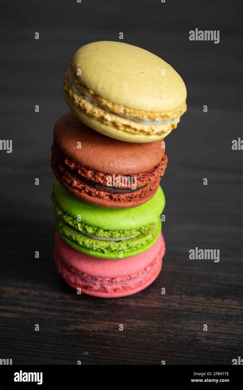 Multi Colored Macarons In The Black Background Stock Photo Alamy