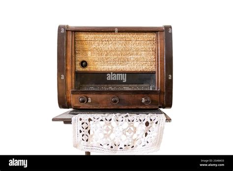 Vintage Tube Radio Tuner Located On A Wooden Shelf And A Cloth Made Of