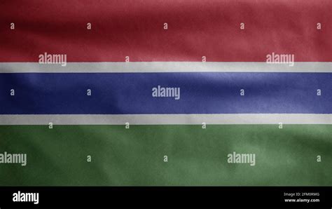 Gambian Flag Waving In The Wind Close Up Of Gambia Banner Blowing