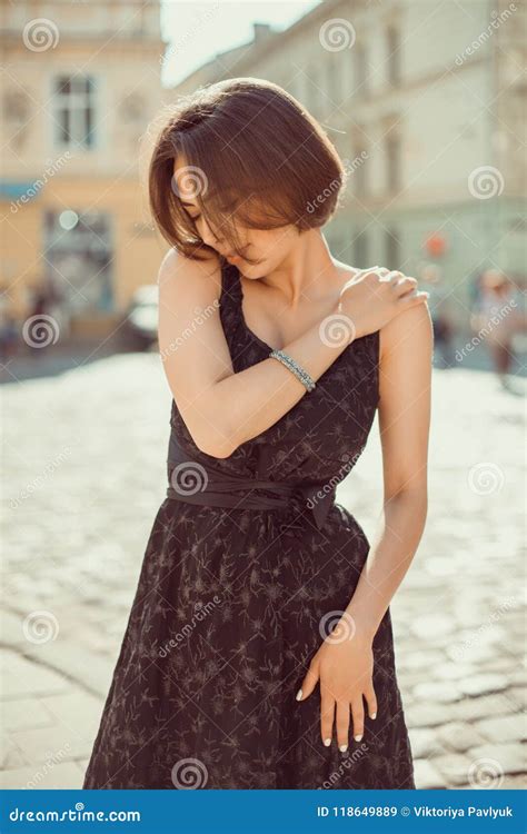 Outdoot Portrait Of Lovely Brunette Girl Wearing Trendy Dress P Stock