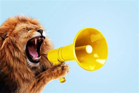 Premium Photo Cool Beautiful Lion Holding And Screaming Into A Yellow Loudspeaker On A Blue