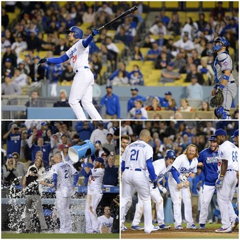 Baseball Players In Blue And White Uniforms At A Game