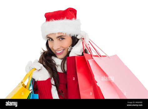 Festive Brunette In Winter Wear Holding Shopping Bags On White