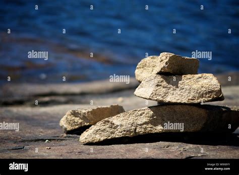 Stacked Rocks On Lake Shore Stock Photo Alamy