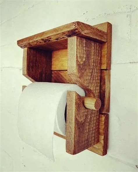 A Toilet Paper Holder Made Out Of Wood