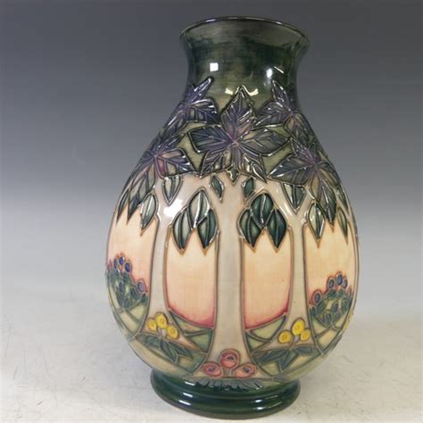 A Moorcroft Cluny Pattern Vase With Tubelined Decoration On Salmon