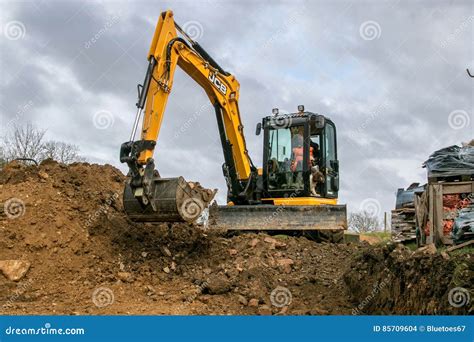 A Digger Moving Soil Editorial Stock Image Image Of Drive 85709604