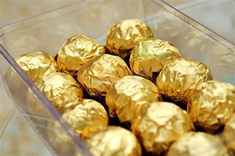 Chocolate Wrapped In Gold Foils Stock Photo - Image: 10162204