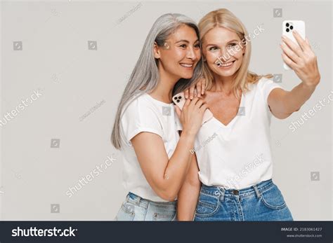Mature Multiracial Women Wearing T Shirts Smiling Stock Photo Shutterstock